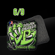 Load image into Gallery viewer, Green Lightning Design on a black background Draggin&#39; Bags Power Draggin Series carpet bag cornhole bag on a black and grey background