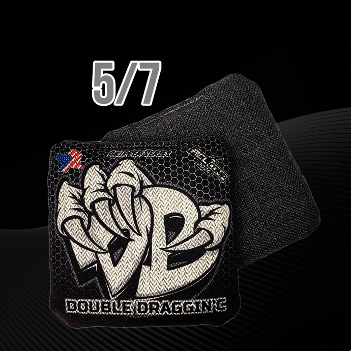 Black and White Draggin' Bags Double Draggin series carpet bag cornhole bag on a black and grey background